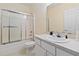 Clean bathroom with a shower/tub combo and updated vanity at 122 Turnbull Villas Cir, New Smyrna Beach, FL 32168