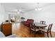 Bright dining room with hardwood floors and access to a patio at 122 Turnbull Villas Cir, New Smyrna Beach, FL 32168