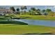 Golf course view with water feature and homes in background at 122 Turnbull Villas Cir, New Smyrna Beach, FL 32168