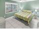 Bright bedroom with a king-size bed and tiled floors at 1253 Harbour Point Dr, Port Orange, FL 32127