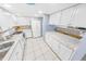 Updated kitchen featuring white cabinetry and granite countertops at 1253 Harbour Point Dr, Port Orange, FL 32127