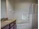 Bathroom with granite countertop, tub, and shower at 126 Vista Verdi Cir # 204, Lake Mary, FL 32746