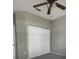 Bedroom featuring closet with sliding doors and overhead ceiling fan at 126 Vista Verdi Cir # 204, Lake Mary, FL 32746
