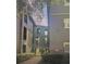 Exterior view of a building with an arched entryway and manicured landscaping at 126 Vista Verdi Cir # 204, Lake Mary, FL 32746