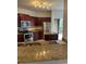 Kitchen features stainless steel appliances, granite countertops, and wood cabinets at 126 Vista Verdi Cir # 204, Lake Mary, FL 32746