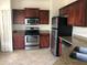 Kitchen features stainless steel appliances, granite countertops, and tile flooring at 126 Vista Verdi Cir # 204, Lake Mary, FL 32746