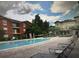 Community pool with lounge chairs and well-maintained landscaping at 126 Vista Verdi Cir # 204, Lake Mary, FL 32746