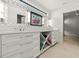 Modern bathroom with double vanity and patterned wallpaper at 1309 Hill St, New Smyrna Beach, FL 32169