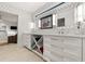 Modern bathroom with double vanity and open shelving at 1309 Hill St, New Smyrna Beach, FL 32169