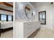 Elegant bathroom with double vanity and patterned wallpaper at 1309 Hill St, New Smyrna Beach, FL 32169