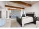 Bedroom with a patterned wall and wooden beams at 1309 Hill St, New Smyrna Beach, FL 32169