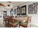 Elegant dining area with a light wood table and built-in bench seating at 1309 Hill St, New Smyrna Beach, FL 32169