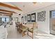 Elegant dining area with a light wood table and built-in bench seating at 1309 Hill St, New Smyrna Beach, FL 32169