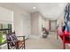 Bright hallway with a red console table and seating at 1309 Hill St, New Smyrna Beach, FL 32169