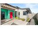 Modern home exterior with teal accents and red door at 1309 Hill St, New Smyrna Beach, FL 32169