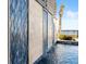 Stunning water feature with blue tile and ocean backdrop at 1309 Hill St, New Smyrna Beach, FL 32169