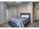 Bright bedroom with double bed, dresser, and ceiling fan at 132 Vista Verdi Cir # 100, Lake Mary, FL 32746