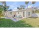 Backyard view showing patio and a portion of the house at 142 Jean Francis Ln, Port Orange, FL 32127