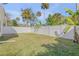 Large grassy backyard with a white fence at 142 Jean Francis Ln, Port Orange, FL 32127