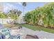 Spacious backyard with patio and tropical landscaping at 142 Jean Francis Ln, Port Orange, FL 32127