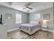 Cozy bedroom with a queen-size bed and wood-look floors, creating a relaxing atmosphere at 142 Jean Francis Ln, Port Orange, FL 32127