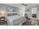 Spacious bedroom with a king-size bed, wood floors, and an ensuite bathroom at 142 Jean Francis Ln, Port Orange, FL 32127