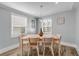 Bright dining room with light wood table and chairs, offering a space for Gathering meals at 142 Jean Francis Ln, Port Orange, FL 32127