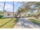 Charming single story home with a spacious driveway and lush landscaping at 142 Jean Francis Ln, Port Orange, FL 32127