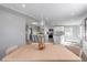 Open concept kitchen and dining area with modern white cabinets and stainless steel appliances at 142 Jean Francis Ln, Port Orange, FL 32127