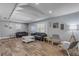 Spacious living room with gray sofas, wood-look floors, and a vaulted ceiling at 142 Jean Francis Ln, Port Orange, FL 32127