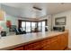 Kitchen with ocean view, breakfast bar, wood cabinets at 1571 S Atlantic Ave # 4110, New Smyrna Beach, FL 32169