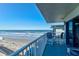 Balcony with ocean view, beach, and seating for two at 1571 S Atlantic Ave # 4110, New Smyrna Beach, FL 32169