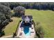 Overhead view of house with pool and patio area, surrounded by lush landscaping at 182 Kentucky Blue Cir, Apopka, FL 32712