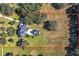 Drone view of house, pool, and large lot, ideal for those seeking privacy at 182 Kentucky Blue Cir, Apopka, FL 32712