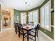 Breakfast nook with green walls and white shutters at 182 Kentucky Blue Cir, Apopka, FL 32712