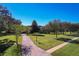 Brick driveway leading to a spacious two-story house at 182 Kentucky Blue Cir, Apopka, FL 32712