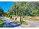 Stone entrance to the community with a horse statue and sign at 182 Kentucky Blue Cir, Apopka, FL 32712