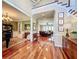 Bright two-story foyer with hardwood floors and elegant staircase at 182 Kentucky Blue Cir, Apopka, FL 32712