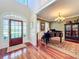 Elegant entryway with hardwood floors, grand staircase, and piano at 182 Kentucky Blue Cir, Apopka, FL 32712