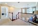 Upstairs hallway with window and view of the stairs at 182 Kentucky Blue Cir, Apopka, FL 32712