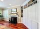 Living room with fireplace, built-in shelving, hardwood floors at 182 Kentucky Blue Cir, Apopka, FL 32712