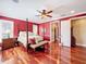 Spacious main bedroom with hardwood floors and a four-poster bed at 182 Kentucky Blue Cir, Apopka, FL 32712