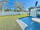 Spacious backyard with patio, shed, and grassy lawn at 2101 Oriole Ln, South Daytona, FL 32119