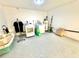 This garage laundry area features a washer and dryer and storage containers at 2101 Oriole Ln, South Daytona, FL 32119