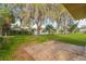 Large backyard with lush grass and mature trees at 211 Maurice Ave, New Smyrna Beach, FL 32168