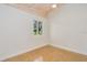 Bright bedroom with a window offering a view and terrazzo flooring at 211 Maurice Ave, New Smyrna Beach, FL 32168