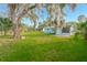 Exterior view of the house with green lawn at 211 Maurice Ave, New Smyrna Beach, FL 32168