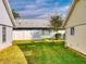 Private backyard with grassy area and white fence at 216 Fairgreen Ave, New Smyrna Beach, FL 32168