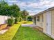 Spacious backyard with patio and lush landscaping at 216 Fairgreen Ave, New Smyrna Beach, FL 32168