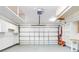 Garage with built-in shelving and overhead storage at 216 Fairgreen Ave, New Smyrna Beach, FL 32168